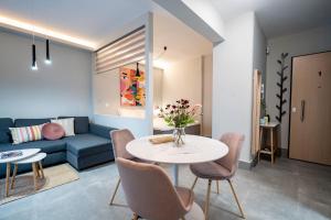 A seating area at Evaggelismos m station studio for 3 pers by MPS