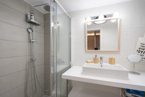 A bathroom at Evaggelismos m station studio for 3 pers by MPS