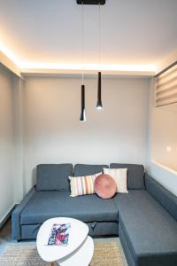 A seating area at Evaggelismos m station studio for 3 pers by MPS