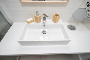 A bathroom at Evaggelismos m station studio for 3 pers by MPS