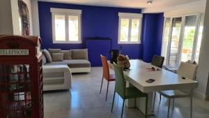 a living room with a table and a couch at TRIPLEX DE LUJO EN MOJACAR in Mojácar
