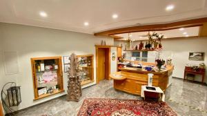 a large room with a counter in a store at Hotel Krone in Neuenburg am Rhein