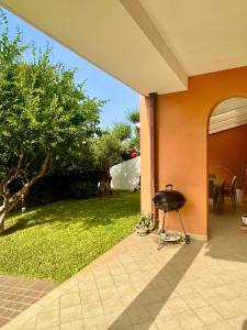 a barbecue grill sitting outside of a house at VillApulia in Brindisi