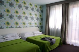 Postel nebo postele na pokoji v ubytování Key Hotel