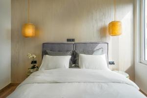 Posteľ alebo postele v izbe v ubytovaní Stylish Living-Parthenon