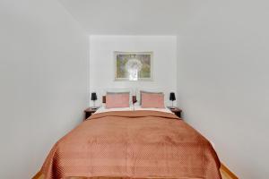Posteľ alebo postele v izbe v ubytovaní NORDBYHUS Apartamenty Stara Winiarnia