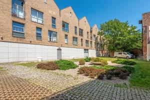 Vonkajšia záhrada v ubytovaní NORDBYHUS Apartamenty Stara Winiarnia