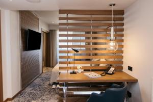 a desk in a room with a wall at InterContinental Barcelona by IHG in Barcelona