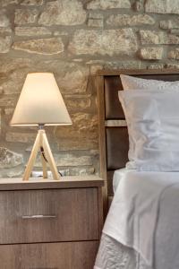 Posteľ alebo postele v izbe v ubytovaní TAKIS GUESTHOUSE- Laoura-HERMOUPOLIS