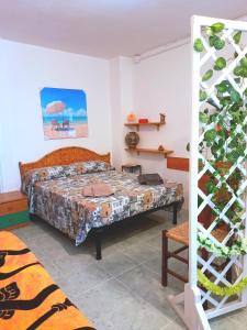 Postel nebo postele na pokoji v ubytování LA QUERCIA SUITES - taverna nel borgo medievale