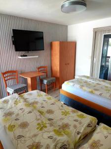 Posteľ alebo postele v izbe v ubytovaní Hotel Olga