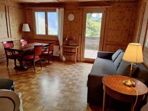 a living room with a couch and a table at Grosse 2 ZImmer Wohnung mit Terrasse in Bad Ragaz