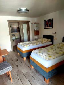 Posteľ alebo postele v izbe v ubytovaní Hotel Olga
