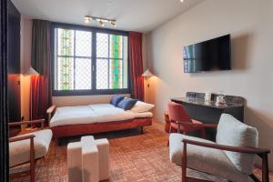 TV a/nebo společenská místnost v ubytování Heavens Hotel