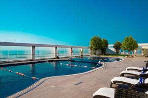 a swimming pool on the top of a building at Nordic Palace and spa in Manama