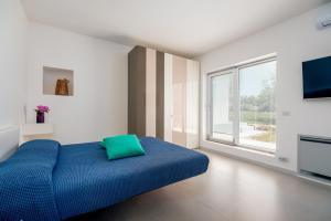 Krevet ili kreveti u jedinici u okviru objekta HelloAPULIA - Design Trulli Sampaolo with private pool