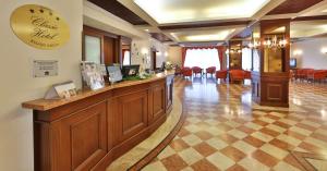 a lobby with a reception desk and a waiting room at Best Western Classic Hotel in Reggio Emilia