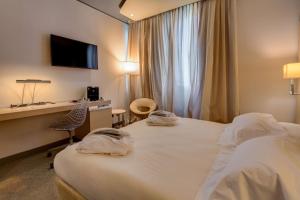 Postel nebo postele na pokoji v ubytování Best Western Plus Hotel Expo