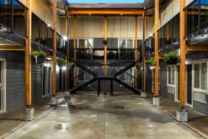 an empty hallway of a building with a spiral staircase at Econo Lodge in Prince George +49 photos