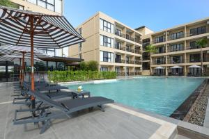 Bazén v ubytování BS Residence Suvarnabhumi nebo v jeho okolí