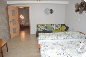 Posteľ alebo postele v izbe v ubytovaní Hotel Olga
