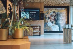a store with a poster of a woman on the wall at die HOCHKÖNIGIN - Mountain Resort in Maria Alm am Steinernen Meer
