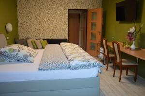 Posteľ alebo postele v izbe v ubytovaní Hotel Olga