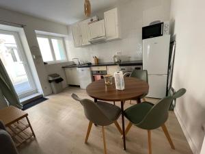 Kuchyňa alebo kuchynka v ubytovaní L’olivier - Appartement