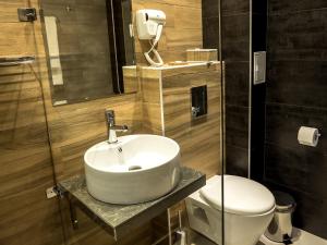 Um banheiro em Hotel Calipso Hotel