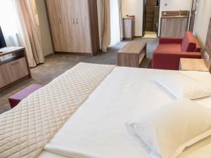 Cama ou camas em um quarto em Hotel Calipso Hotel