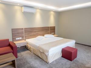Cama ou camas em um quarto em Hotel Calipso Hotel