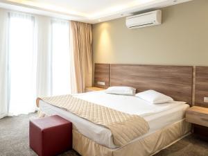 Cama ou camas em um quarto em Hotel Calipso Hotel