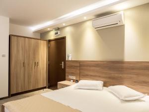 Cama ou camas em um quarto em Hotel Calipso Hotel