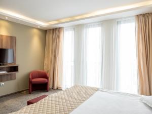 Cama ou camas em um quarto em Hotel Calipso Hotel