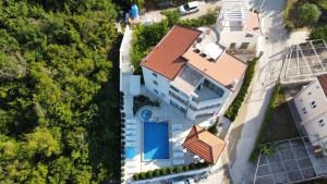 an overhead view of a house with a swimming pool at Villa Rakhimov in Herceg-Novi