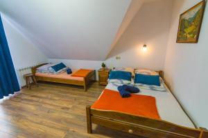 Кровать или кровати в номере Willa na Brzyzku