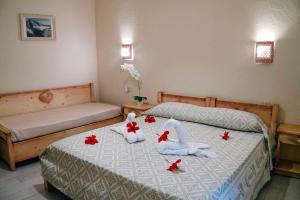 Katil atau katil-katil dalam bilik di Hotel Oleandro