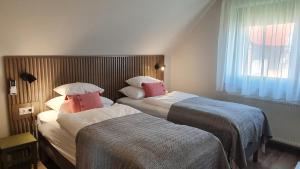 Posteľ alebo postele v izbe v ubytovaní Relax Balaton Apartmanok