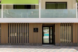 a building with a door in front of it at Caleyro Boutique Apartments - "Parking incluido" in Fuengirola +76 photos