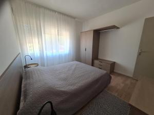 Postel nebo postele na pokoji v ubytování Apartments Bianca
