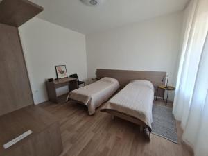 Postel nebo postele na pokoji v ubytování Apartments Bianca