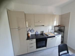 Kuchyň nebo kuchyňský kout v ubytování Apartments Bianca