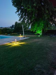 a garden with a light in the grass at Marinella B&B in Cornale