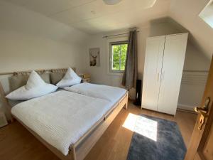 Giường trong phòng chung tại Schmallenberger Ferienhaus +35 ảnh