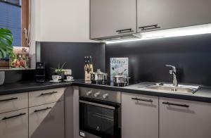 Nhà bếp/bếp nhỏ tại Arthur's Hotel und Apartments am Achensee