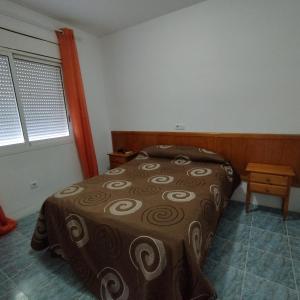 Cama o camas de una habitación en Villas Port Tropical