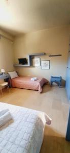 Posteľ alebo postele v izbe v ubytovaní Aggelika's Home