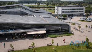 an overhead view of a building with a parking lot at Aqua Hotel in Kecskemét