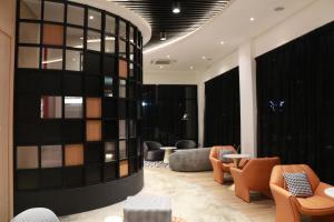 Posezení v ubytování OTEL Hotel Suite + 12 fotografií