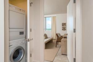 a laundry room with a washer and dryer at Luxurious Private Condo at 1 Hotel & Homes -1127 in Miami Beach